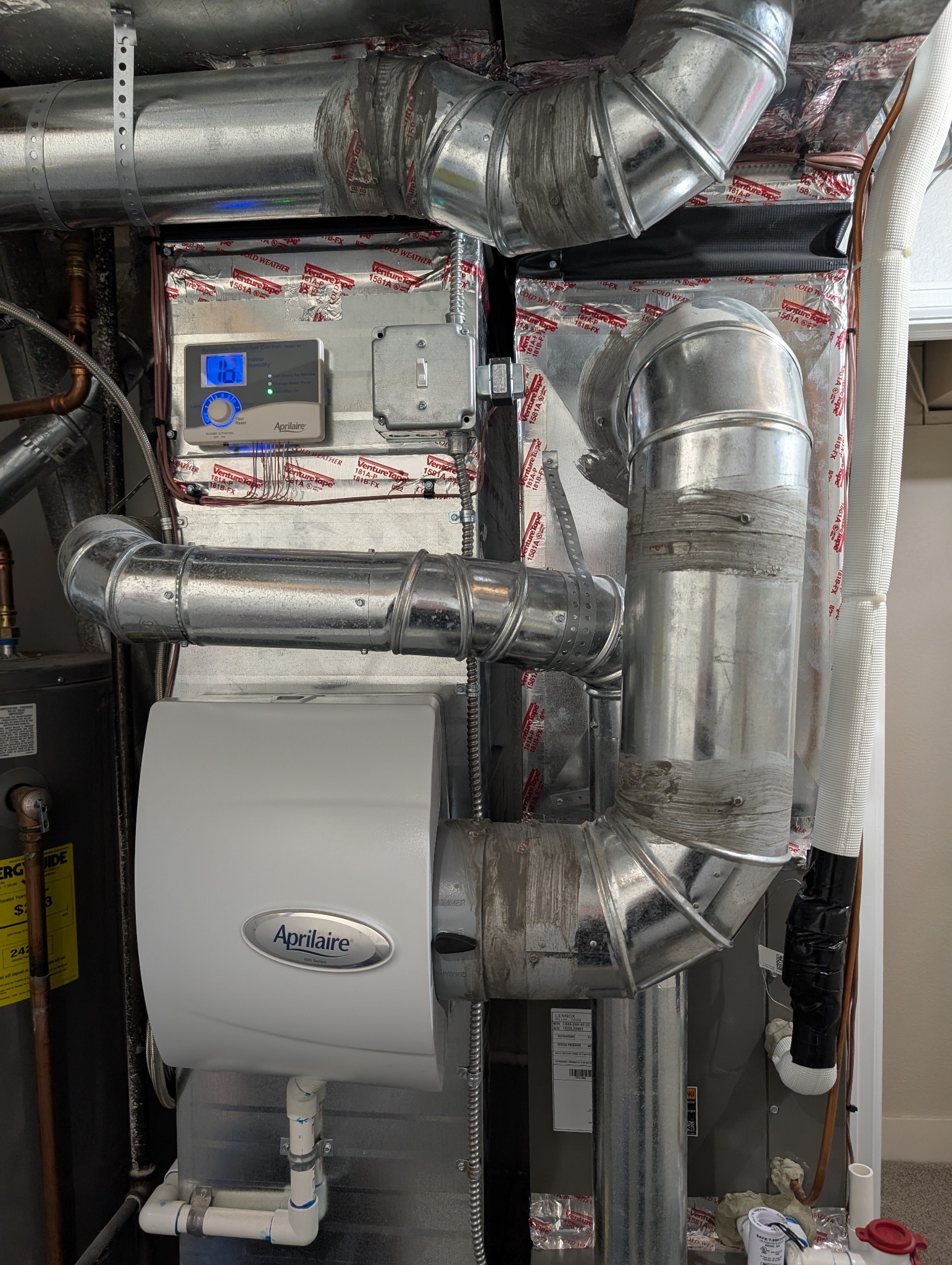 Modern whole home humidifier system installed in a house